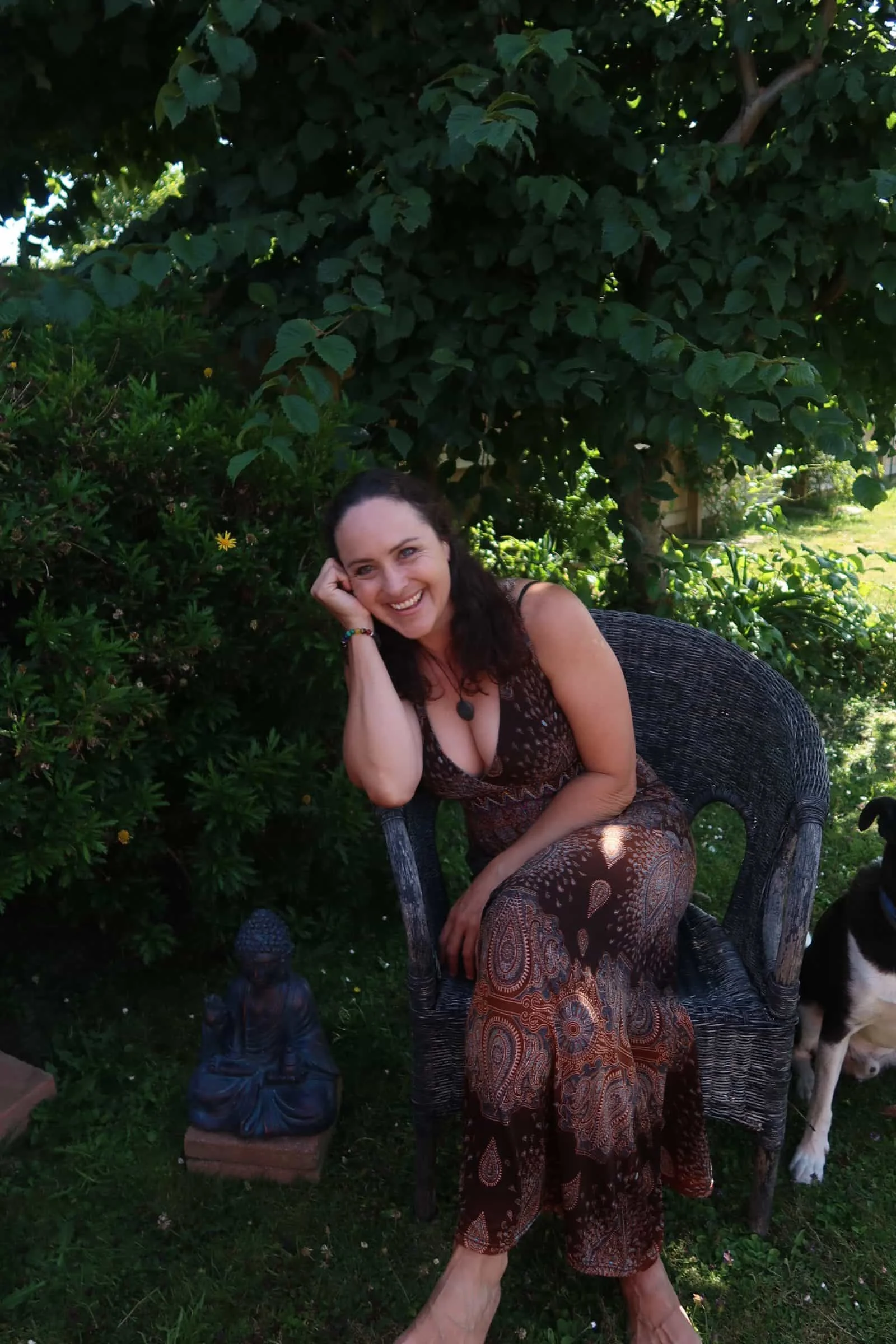 Melissa Potter practicing grounding techniques for holistic health healing in her New Zealand garden